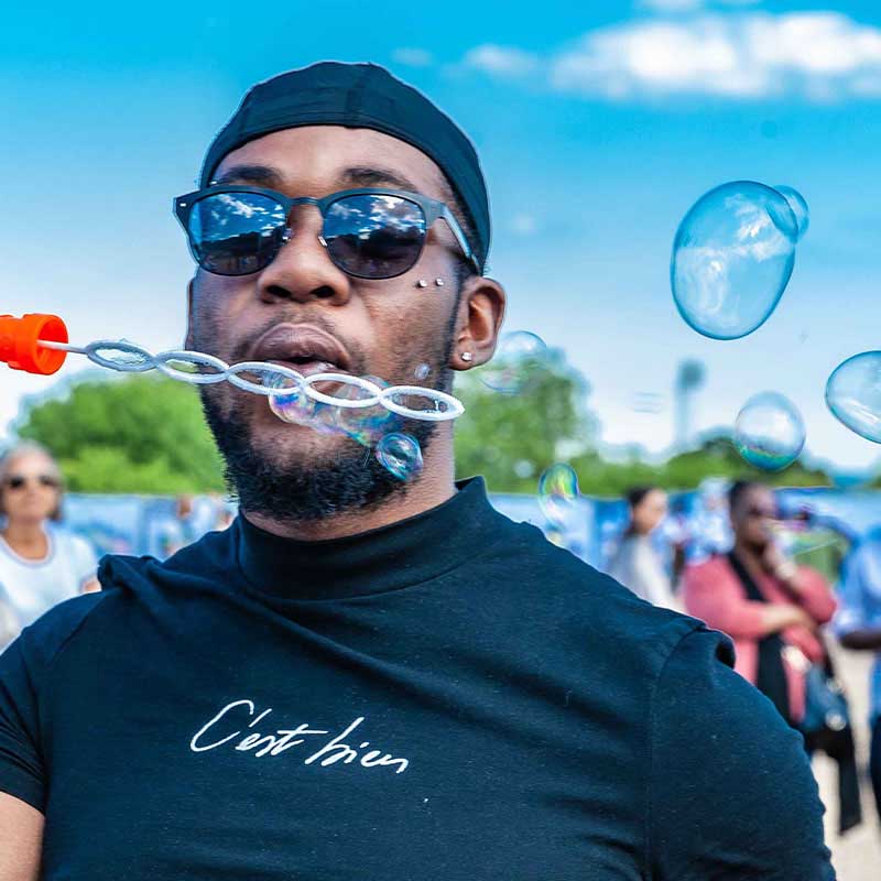 Black Man Blowing Bubbles